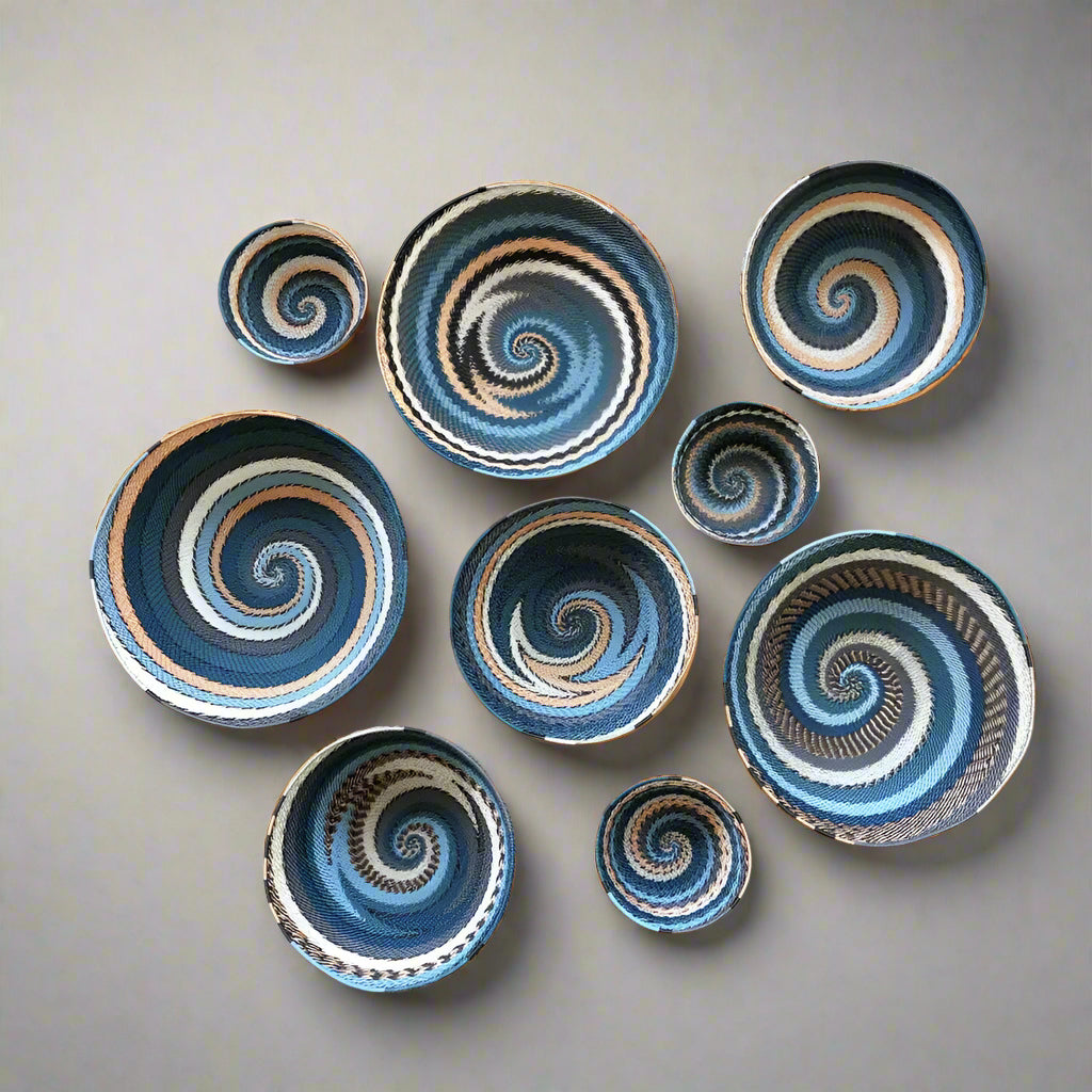 Colorful South Africa city lights woven baskets with spiral patterns in blue white brown