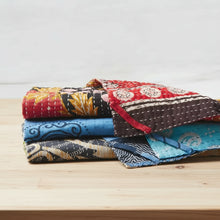 Handmade eco-friendly Kantha towel with vibrant patchwork quilt and intricate embroidery
