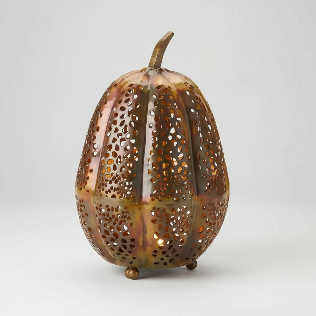 Handmade eco-friendly copper-colored pumpkin lantern with perforations for LED candle use