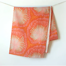 Handmade eco-friendly orange and pink patterned linen table runner with sunburst design