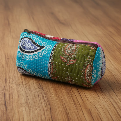 Handmade eco-friendly patchwork quilted pencil case with colorful paisley patterns and green fabric
