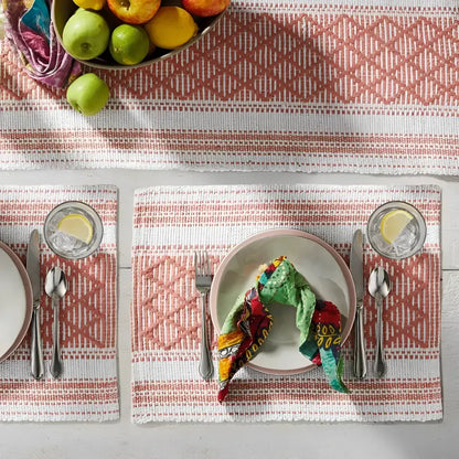 Handmade eco-friendly coral and white woven placemat with geometric pattern design