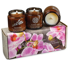 Scented candles with burning wicks in a sea salt orchid gift box, perfect for gifting