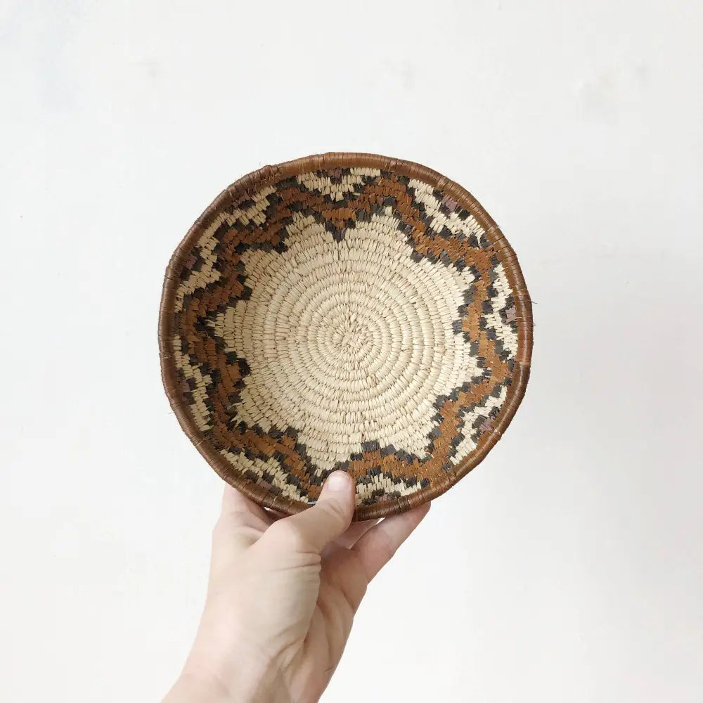 Hand-held woven grass basket with zig-zag pattern from South African woven basket set