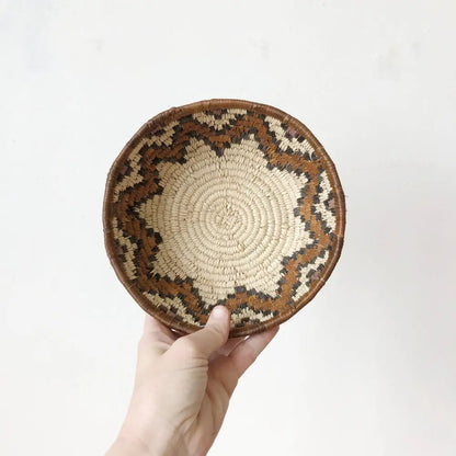 Hand-held woven grass basket with zig-zag pattern from South African woven basket set