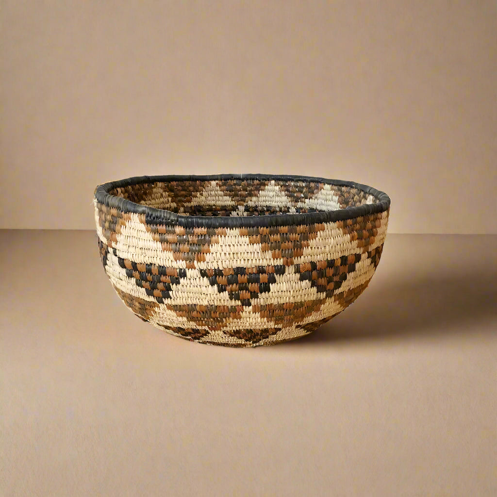 Hand-woven South Africa bowl with geometric pattern made from ilala palm and wild grasses