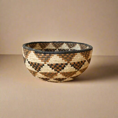 Hand-woven South Africa bowl with geometric pattern made from ilala palm and wild grasses