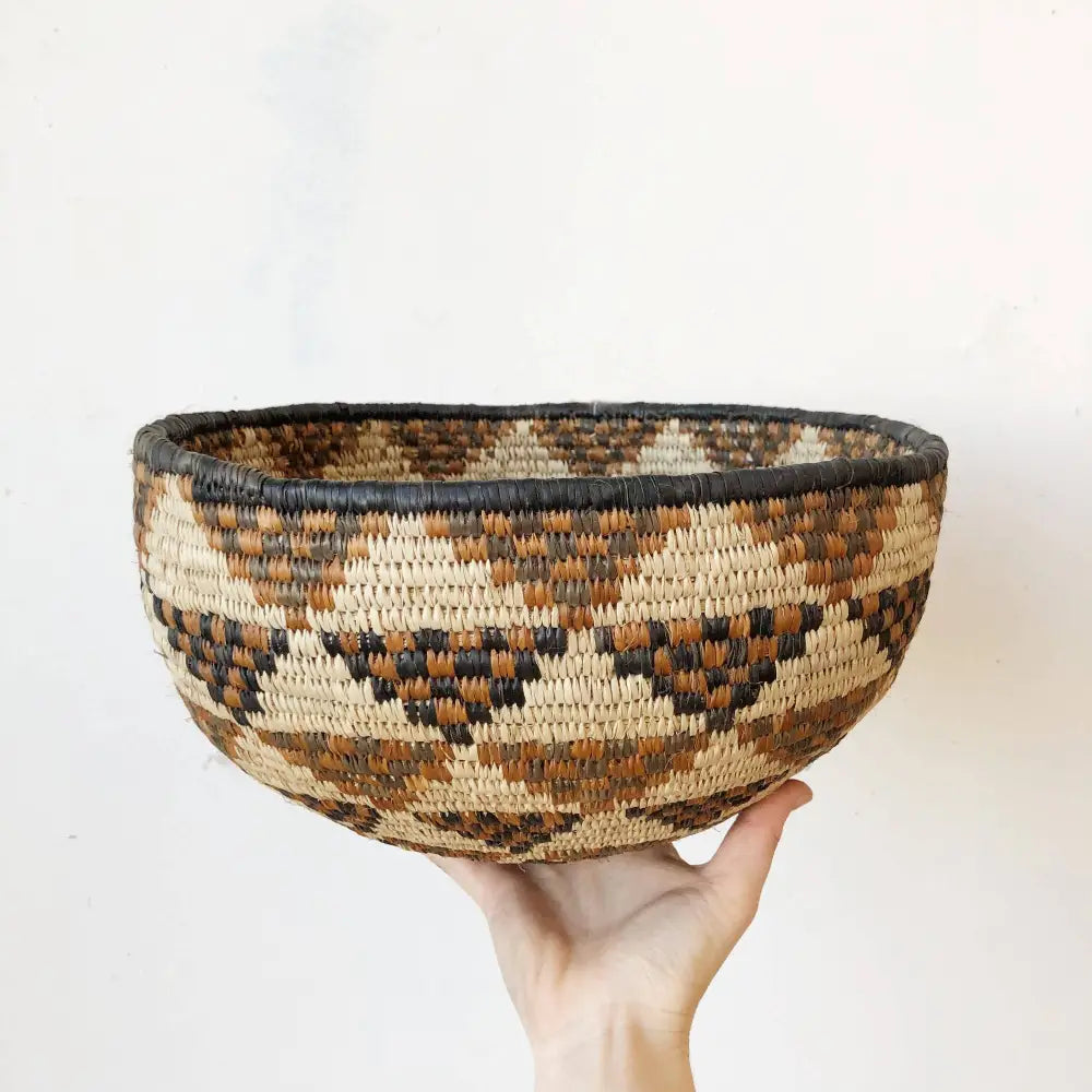 Hand-woven South Africa bowl with geometric pattern made from ilala palm and wild grasses