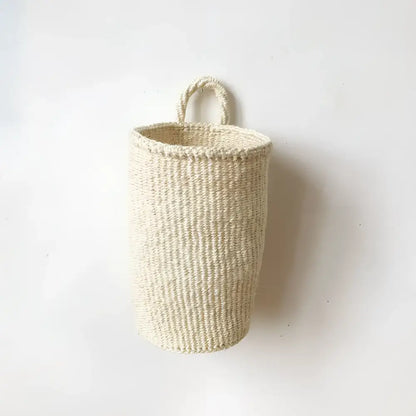 Beige handmade hanging sisal basket with a sturdy loop handle perfect as a decorative hanging basket