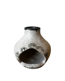 Handmade eco-friendly ceramic birdhouse with black floral design and black rim