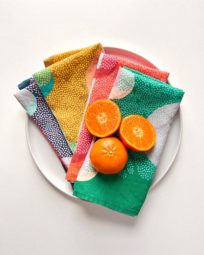 Colorful handmade eco-friendly linen napkins with tangerines for a cozy vibe
