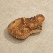 Handmade olive wood tray with handle featuring natural swirling grain patterns perfect for serving favorite snacks