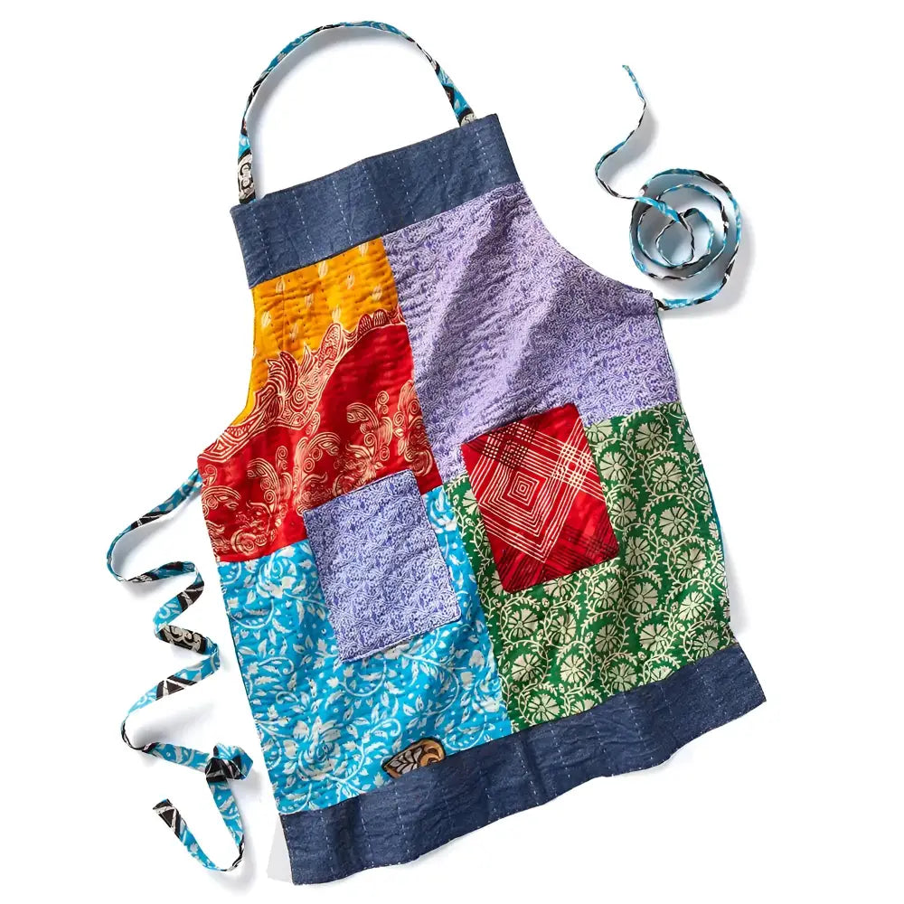 Handmade eco-friendly patchwork apron with upcycled cotton, denim accents, and colorful squares