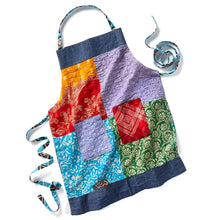 Handmade eco-friendly patchwork apron with upcycled cotton, denim accents, and colorful squares