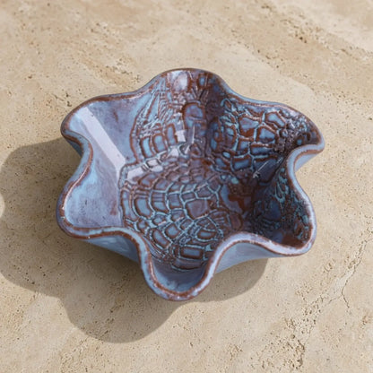 Handmade pottery mini blossom bowl with delicate lace imprints and scalloped blue and brown crackled glaze edges
