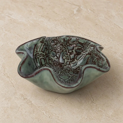 Handmade pottery mini blossom bowl with soft sage green glaze and delicate lace imprints on ruffled edges