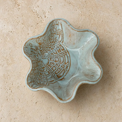 Handmade pottery mini blossom bowl in light blue stoneware with delicate lace imprints and scalloped edge design