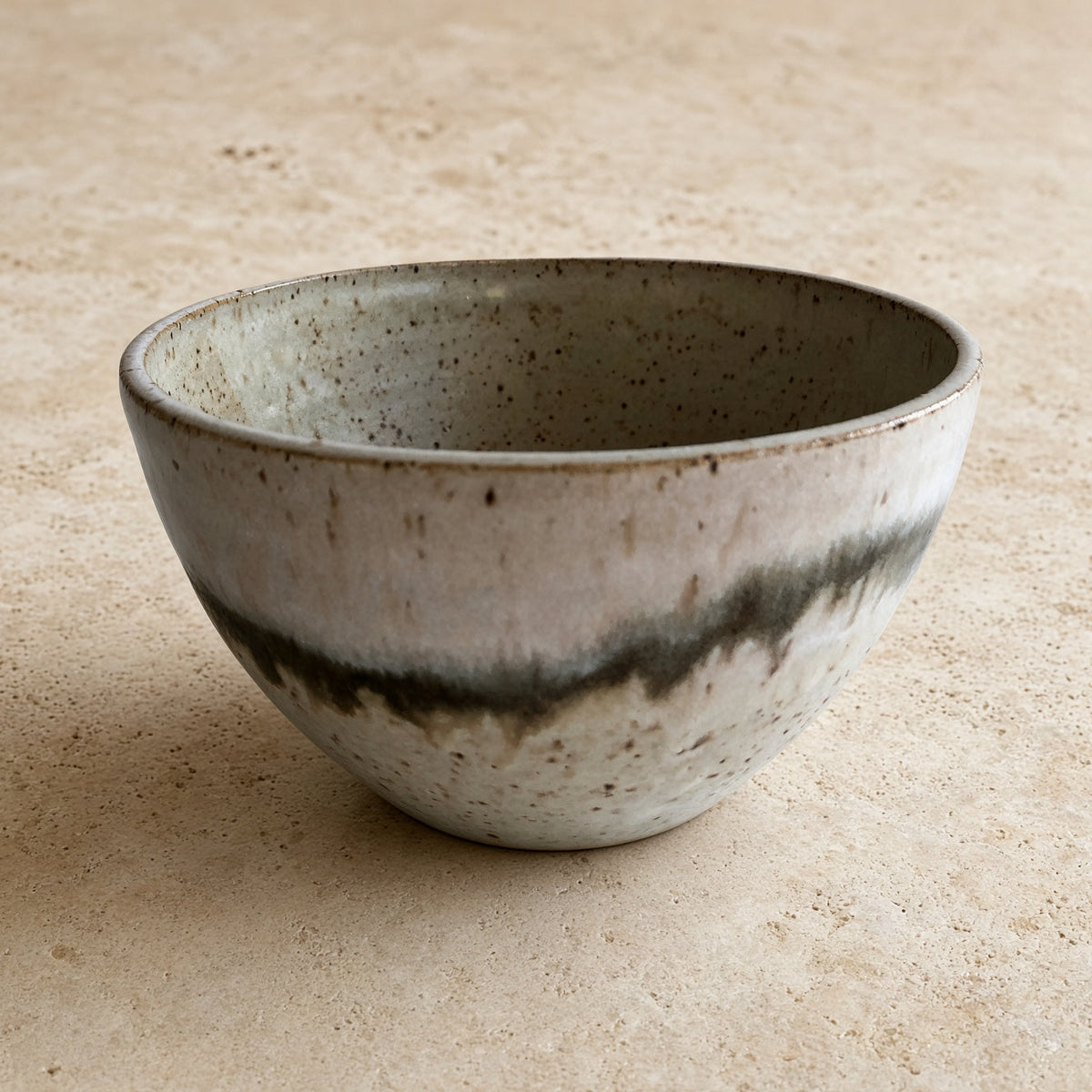 Handmade pottery soup bowl with unique borealis glaze features a speckled gray white finish and organic appeal