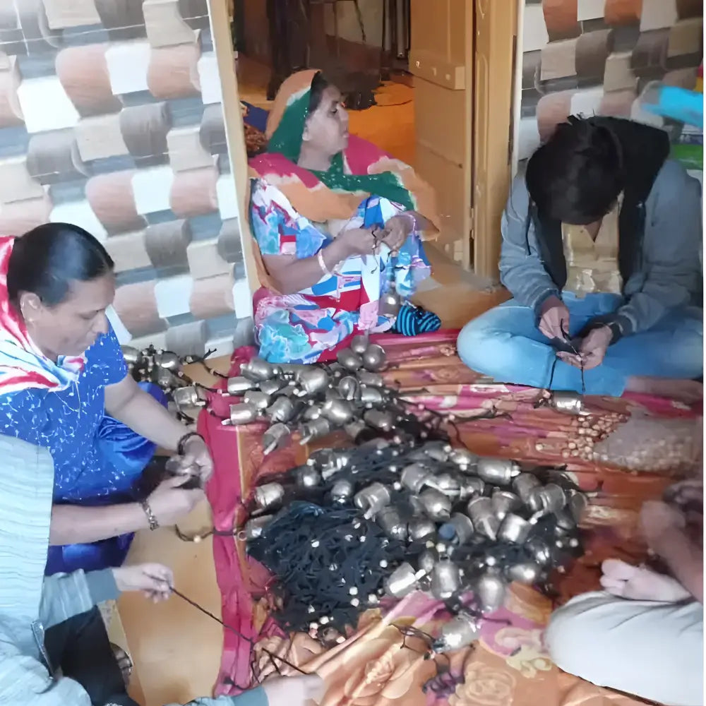 Handmade rustic cascading harmony bells with black rope cords