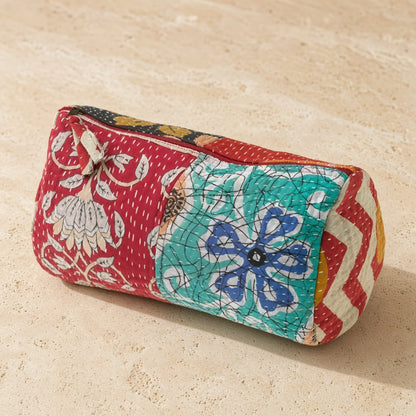 Handmade sari patchwork toiletry case with vibrant red teal white floral and geometric fabric panels