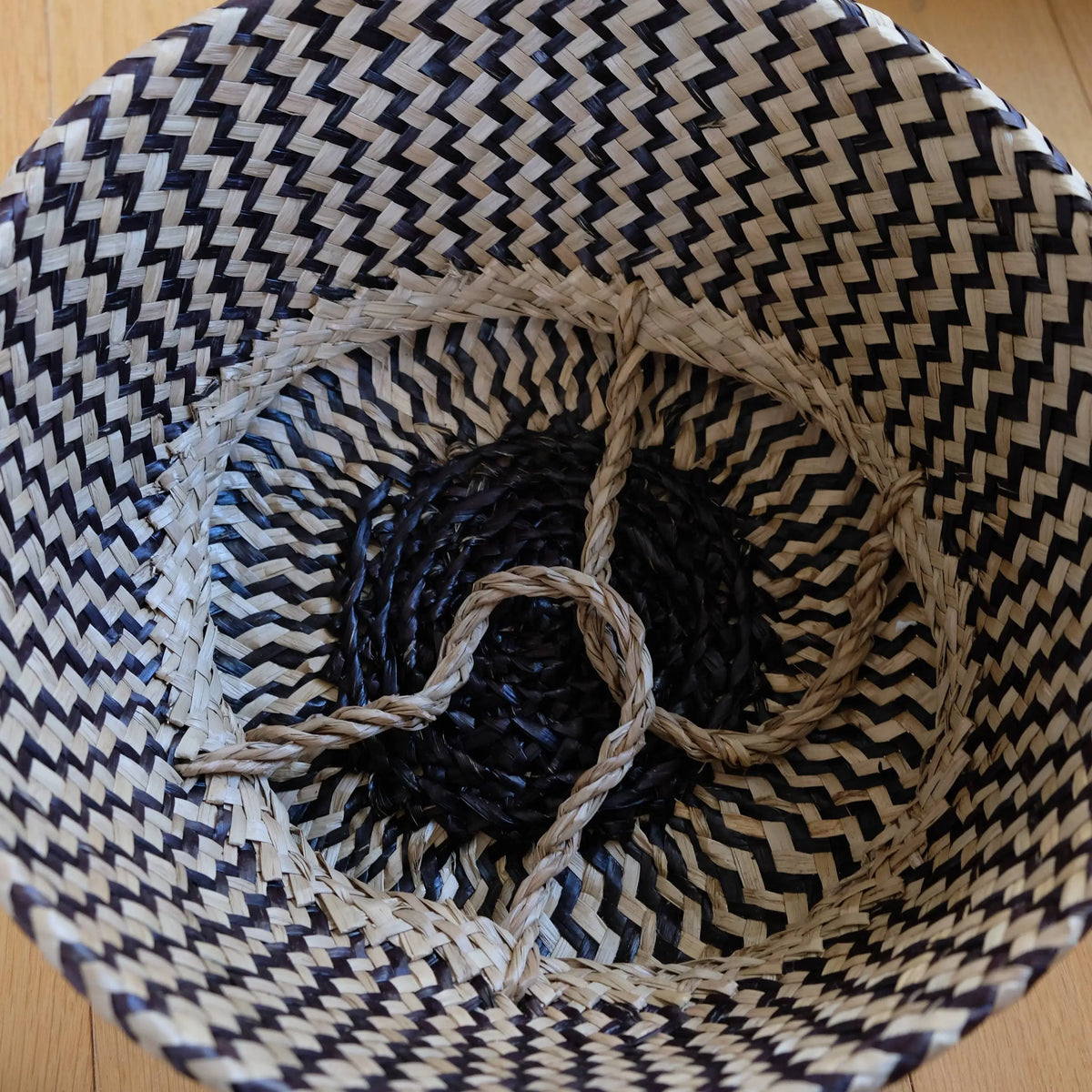 Handmade Belly Basket with black zig-zag patterns and natural rope handles