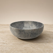 A sleek gray handmade soapstone bowl with smooth speckled surface perfect for displaying artisan soaps or favorite smudge sticks