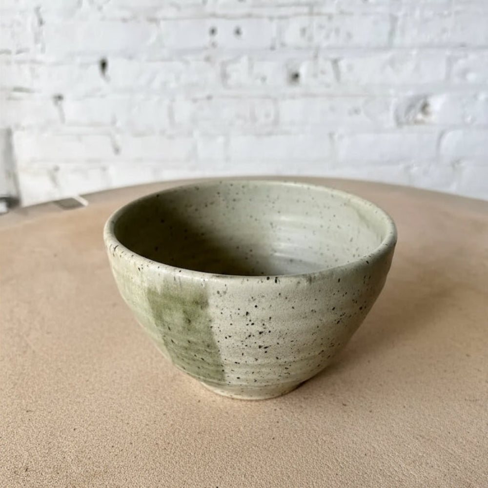 Handmade eco-friendly ceramic dinnerware set with a green color combo and speckled glaze