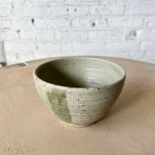 Handmade eco-friendly ceramic dinnerware set with a green color combo and speckled glaze