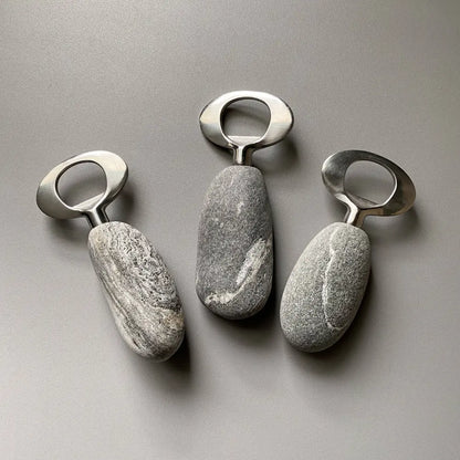 Handmade stainless steel bottle openers with natural stone texture and metallic rings
