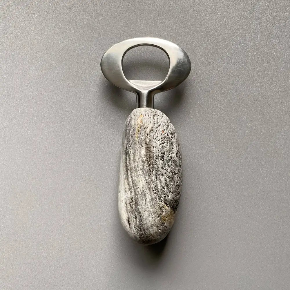 Handmade stainless steel bottle opener with natural stone finish and brushed metal accents