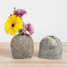 Handmade eco-friendly stone vase with yellow and purple dried flowers for home decor