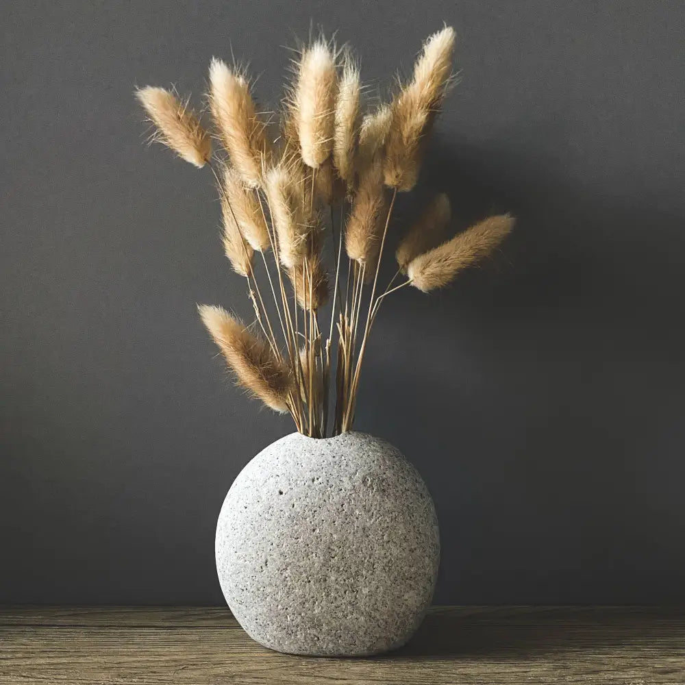 Gray handmade stone vase with pampas grass for eco-friendly home decor