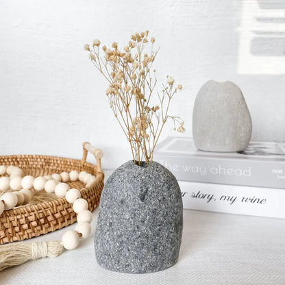 Handmade stone vase with dried flowers, minimalist eco-friendly decor for your space