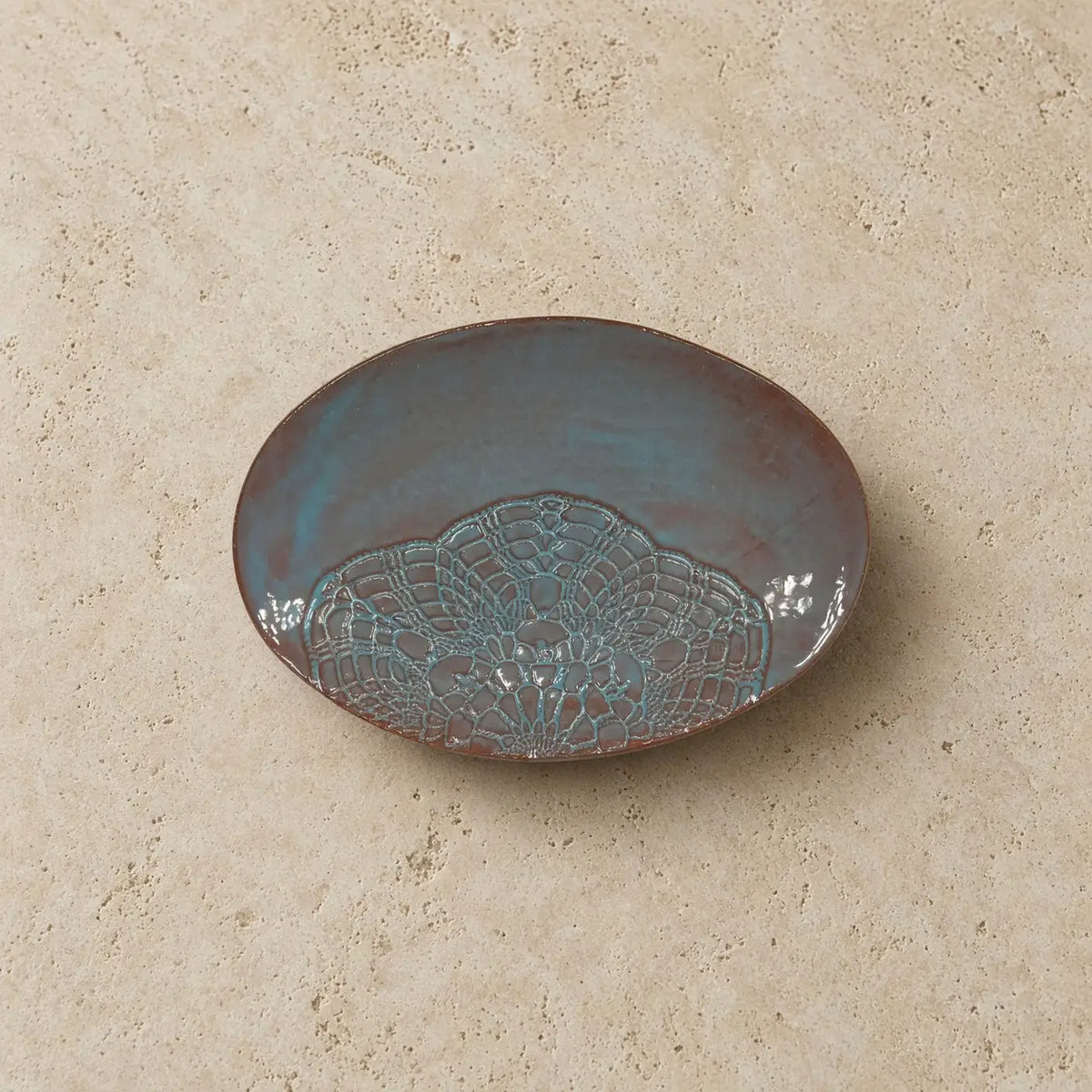 Handmade stoneware oval platter in muted teal with a lace pattern ceramic dish and unique patterns design
