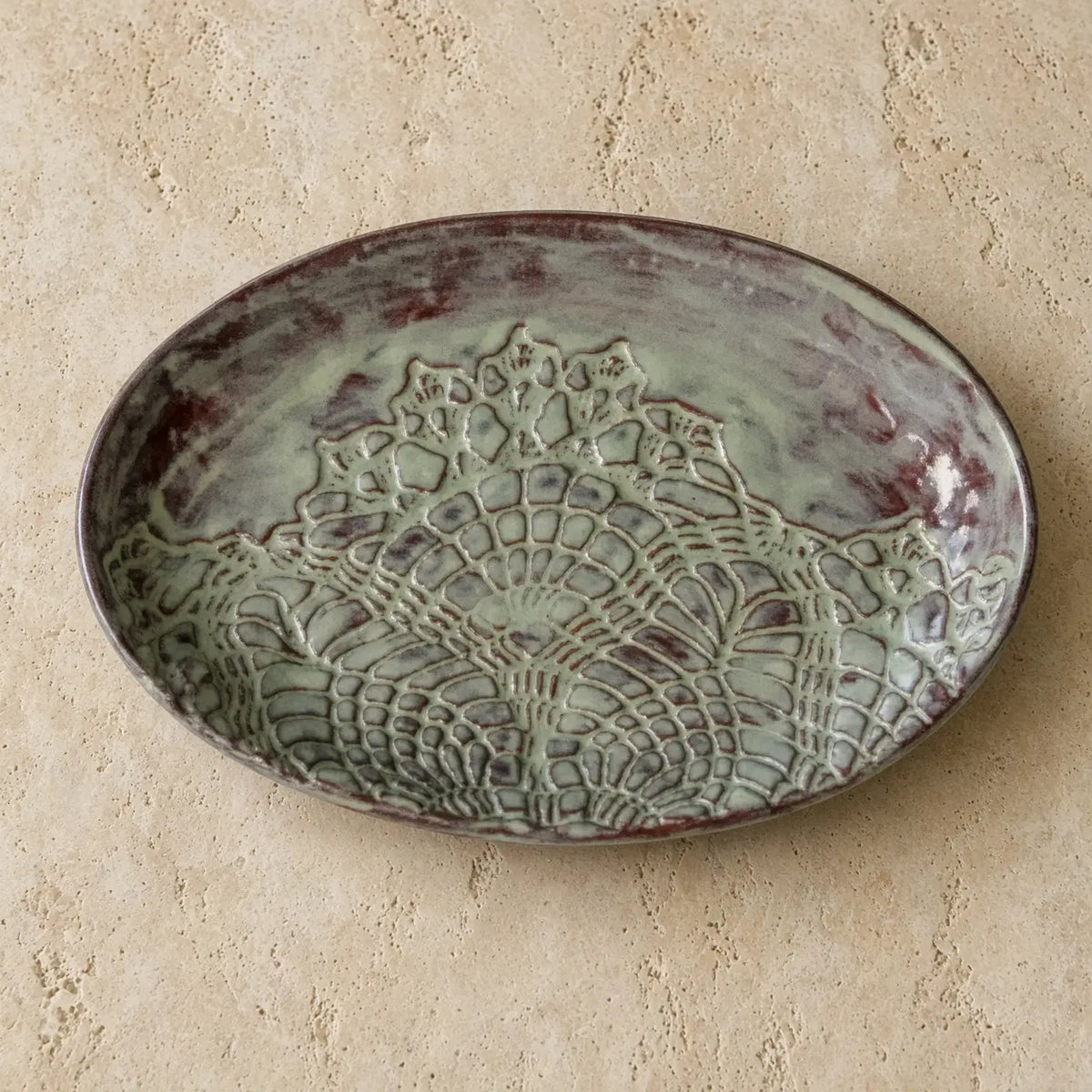 Handmade stoneware oval platter with stunning greenish glaze and lace pattern ceramic dish featuring unique patterns