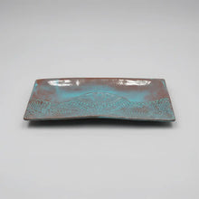 Handmade stoneware serving platter with embossed lace pattern