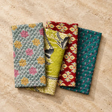 Handmade eco friendly folded sari napkins in vibrant traditional indian patterns with kantha embroidery