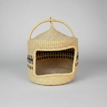 Handmade woven cat bed basket from Bolgatanga with handle and black patterns