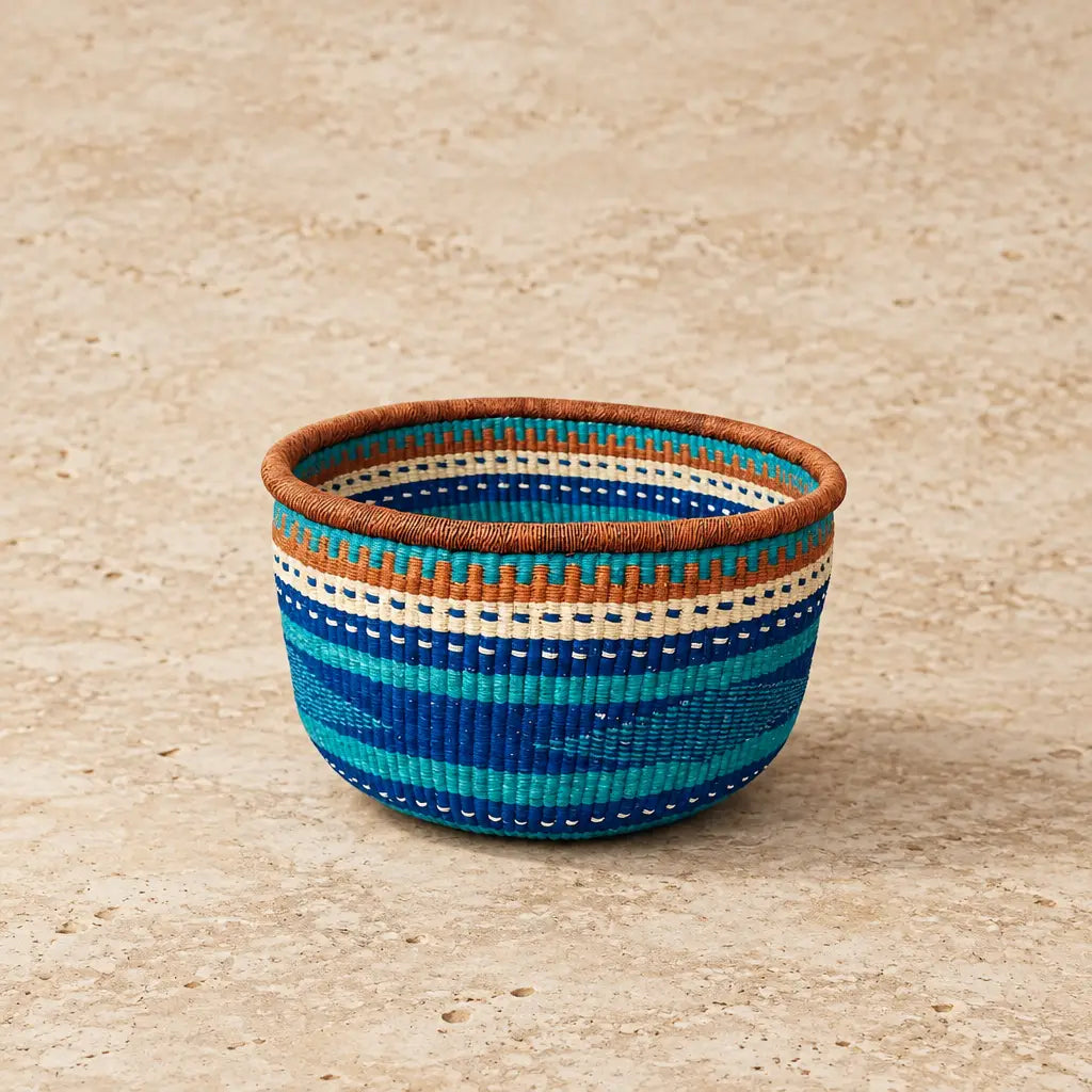 Handwoven bolgatanga african market basket with colorful teal blue cream stripes perfect for storage from bolgatanga region