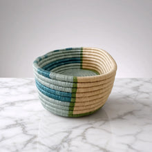 Handwoven african sisal bread basket with horizontal blue and green stripes perfect for serving organizing essentials