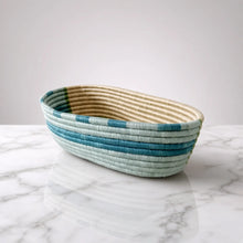 Handwoven african sisal bread basket with blue stripes in light blue teal and cream perfect for serving organizing essentials