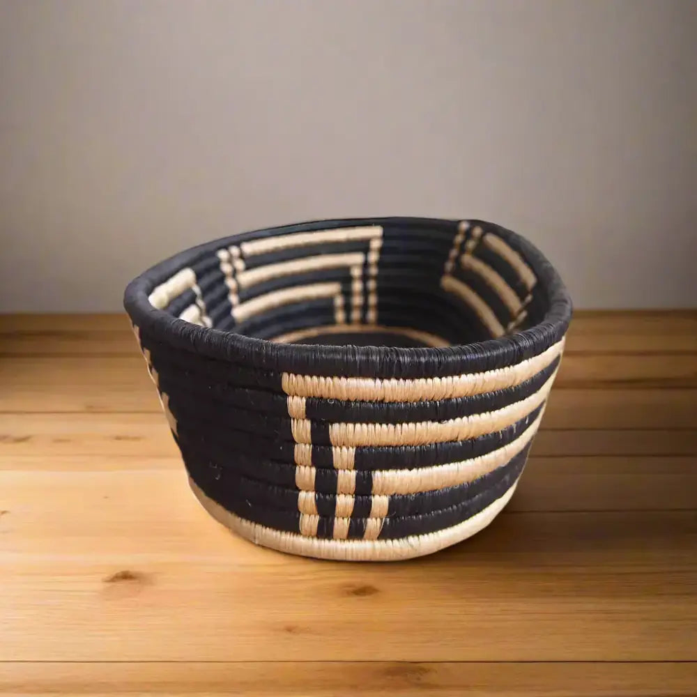 Dark blue and natural-toned handwoven sisal bread basket with geometric patterns