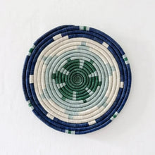 Handwoven african sisal trivet with geometric stars pattern in navy blue cream and green concentric rings