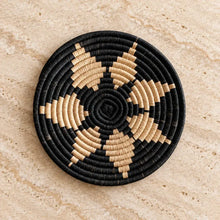 Handwoven african zulu trivet made of ilala palm and wild grasses with natural star black and beige patterns