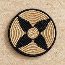 Handwoven african zulu trivet black star with black and natural ilala palm and wild grasses in concentric patterns from south africa
