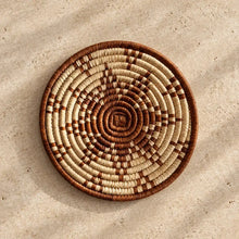 Handwoven african zulu trivet made from ilala palm and wild grasses with natural beige and brown spirals from south africa