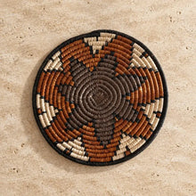 Handwoven african zulu trivet with taupe and brown star pattern made from ilala palm and wild grasses from south africa