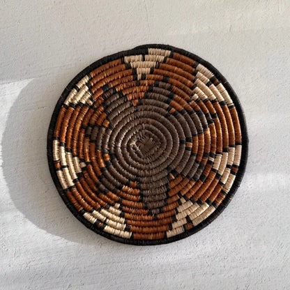 Handwoven african zulu trivet with taupe brown star made of ilala palm and wild grasses from south africa