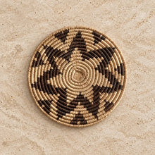 Handwoven african zulu trivet made from ilala palm and wild grasses in taupe and natural beige from south africa