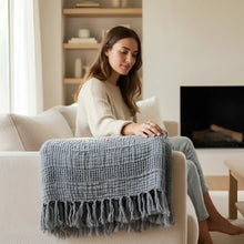 Blue handwoven cotton waffle throw blanket with fringed edges